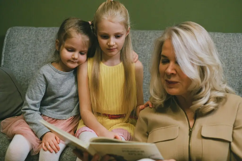 Grandmother reading to children during story time, fostering family connections and love for storytelling